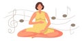 Pregnant woman listens to music in lotus position. Woman with sportswear in lotus pose enjoys music to benefit herself