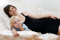 Pregnant woman and little boy Royalty Free Stock Photo