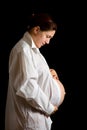 Pregnant woman looking belly Royalty Free Stock Photo