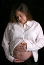 Pregnant woman lookinng down Royalty Free Stock Photo