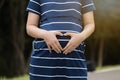 Pregnant woman loving her baby with nature