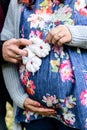 Pregnant woman and loving husband holding baby`s bootees Royalty Free Stock Photo