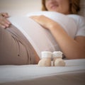 Pregnant woman lying on a bed Royalty Free Stock Photo