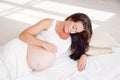 A pregnant woman is lying in bed waiting for the birth of a child Royalty Free Stock Photo