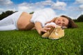 Pregnant woman lying on the grass Royalty Free Stock Photo