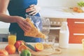 pregnant woman making breakfast with corn flakes Royalty Free Stock Photo