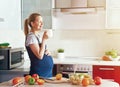 pregnant woman making fruit salad and drinking juice or tea Royalty Free Stock Photo