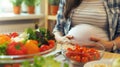 Pregnant Woman Making Salad in Kitchen Royalty Free Stock Photo