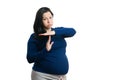 Pregnant woman making time-out gesture