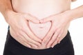 Pregnant woman and man with hand in heart form topless tummy belly in white background Royalty Free Stock Photo