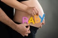 Pregnant Woman And Man Holding Word Baby Royalty Free Stock Photo