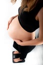 Pregnant woman measures her weight gain in pregnancy on weight scale Royalty Free Stock Photo