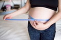 Pregnant woman measuring her belly. Healthy pregnancy. Health pregnancy lifestyle.