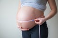 Pregnant woman measuring her belly Royalty Free Stock Photo