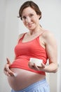 Pregnant Woman Moisturizing Belly