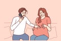 Pregnant woman next to worried husband calling doctor or 911 to report wife birth or marriage Royalty Free Stock Photo