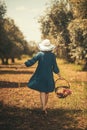 Pregnant woman in olive field back view Royalty Free Stock Photo