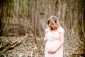 Pregnant woman outdoors relaxing in forest Royalty Free Stock Photo
