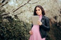 Pregnant Woman with Pc Tablet in Blooming Spring Season Royalty Free Stock Photo