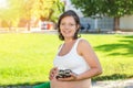 Pregnant Woman playing with little baby boy shoes Royalty Free Stock Photo