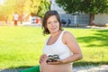 Pregnant Woman playing with little baby boy shoes Royalty Free Stock Photo