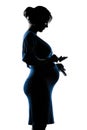 Pregnant woman portrait holding baby shoes Royalty Free Stock Photo
