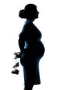 Pregnant woman portrait holding baby shoes Royalty Free Stock Photo