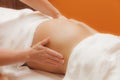 Pregnant woman at prenatal massage, glamour clarity effect Royalty Free Stock Photo