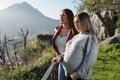 Pregnant woman and pretty girl posing and walking through the countryside Royalty Free Stock Photo