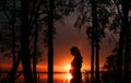 Pregnant woman profile silhouette outside sunset Royalty Free Stock Photo