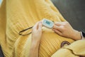 Pregnant woman with pulse oximeter on finger. Doctor measuring oxygen saturation level while visiting expectant mother Royalty Free Stock Photo