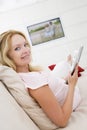 Pregnant woman reading magazine Royalty Free Stock Photo