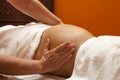 Pregnant woman receiving relaxing massage