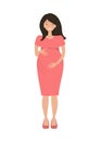 Pregnant woman in red dress. A smiling woman holds her hands on her stomach