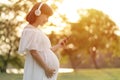 Pregnant woman Relaxing and listening music with headphones Royalty Free Stock Photo