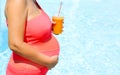 Pregnant woman relaxing outside in swimming pool Royalty Free Stock Photo