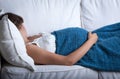 Pregnant woman resting in bed Royalty Free Stock Photo