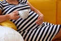 Pregnant woman resting on sofa Royalty Free Stock Photo