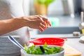 Pregnant woman`s hands washing and selecting salad in the kitchen Royalty Free Stock Photo