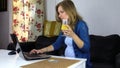 Pregnant woman search info on computer, freshen up fresh juice