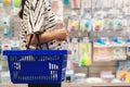 Pregnant woman shopping in baby store. Woman choosing baby stuff at baby shop store Royalty Free Stock Photo