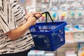 Pregnant woman shopping in baby store. Mom is choosing newborn baby product in supermarket Royalty Free Stock Photo