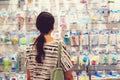 Pregnant woman shopping in baby store. Woman choosing baby stuff at baby shop store Royalty Free Stock Photo