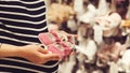 Pregnant woman shopping shoes for her baby girl. Mother doing shopping in baby shop Royalty Free Stock Photo