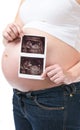 Pregnant woman showing ultrasound picture of her baby Royalty Free Stock Photo