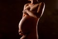 Pregnant woman silhouette over black background Royalty Free Stock Photo