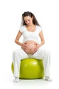 Pregnant woman sitting on fitness ball Royalty Free Stock Photo