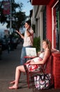 Pregnant woman sitting outside being ignored Royalty Free Stock Photo