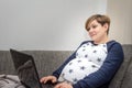 Pregnant Woman using a Laptop