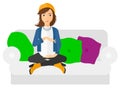 Pregnant woman sitting on sofa Royalty Free Stock Photo